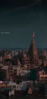 Skyline view of a historic urban temple at dusk.