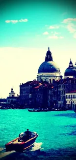 Venice canal view with historic architecture and boat on turquoise water.