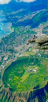 Cliff edge view with city and lush landscape beneath