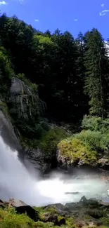 Breathtaking waterfall with lush green forest and blue sky.