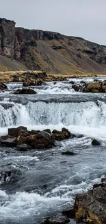 Scenic waterfall with rocky landscape.