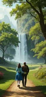 Couple walking towards a waterfall through a lush green landscape.