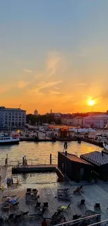 Beautiful waterfront sunset view with vibrant orange hues.