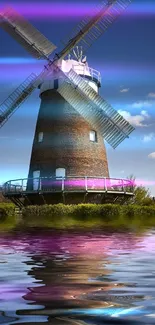 Windmill and neon lights reflected on a serene lake.