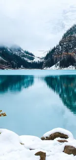 Scenic winter lake with mountains and a cozy figure admiring the view.