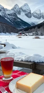 Snowy mountain view with a rustic breakfast and a cozy cabin in the background.