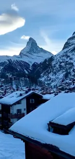 Snowy mountain village with blue sky and scenic winter landscape.