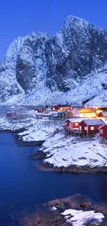 Serene winter village by snowy mountains.