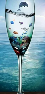 Glass with ocean life against a sunlit sea.