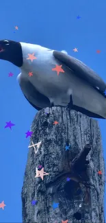 Seagull perched on a pole against a vivid blue sky, ideal for mobile wallpaper.