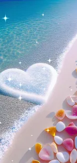 Heart-shaped sand design on a beach with colorful seashells and turquoise waves.