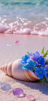 Seashell surrounded by blue flowers on a beach with pink sand and water.