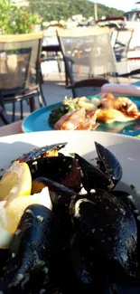 Enjoy seaside dining with a seafood platter featuring mussels and lemon.