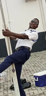 Joyful security guard posing playfully outdoors.