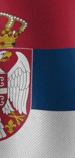 Vibrant Serbian flag with coat of arms.