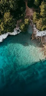 Aerial view of turquoise waters and lush coastal greenery.