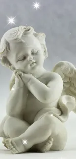 Serene angelic sculpture with soft grey tones.