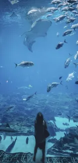 Underwater scene with marine life in blue hues.