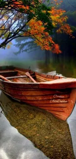 Wooden boat on tranquil autumn lake surrounded by colorful foliage.