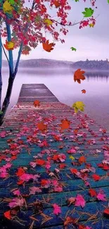 Autumn lake view with red leaves on a misty morning dock, serene and calming.