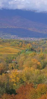 Serene autumn mountain landscape with vibrant forests and rolling hills.