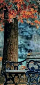 Autumn park bench with orange leaves and tree trunk.