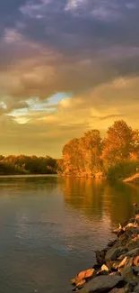 Serene sunset over a tranquil river in autumn hues.