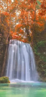 Peaceful waterfall with autumn leaves.