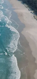 Aerial view of a beach with turquoise waves and sandy shoreline.