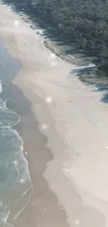 Aerial view of a serene beach, sparkling waves, and sandy shore.