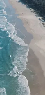 Aerial view of a serene beach with turquoise waves lapping at the pristine coastline.