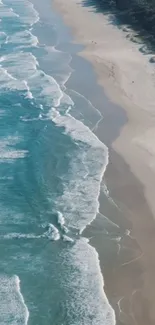 Aerial view of a beach with turquoise waves and sandy shoreline.