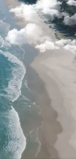 Aerial view of beach with turquoise waters and white clouds.