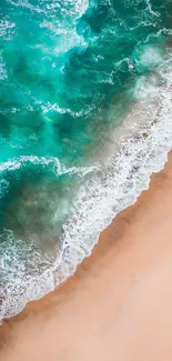 Aerial view of turquoise waves on a sandy beach, creating a serene mobile wallpaper.