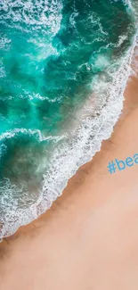 Aerial view of turquoise ocean waves against a sandy beach with #beach text.