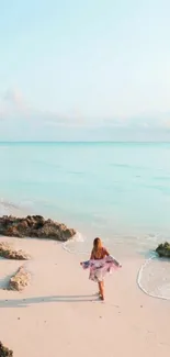 A tranquil beach scene with clear blue water and soft sand.