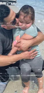 Father holding daughter by the beach, embodying love and serenity.