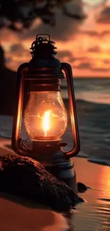 Lantern glowing on a serene beach at sunset