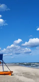 Serene beach with blue sky and lifeguard tower mobile wallpaper.