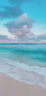 Turquoise ocean beach with soft clouds.