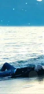 Person lying on tranquil beach with soothing ocean waves in the background.