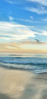 Serene beach with ocean waves under a tranquil blue sky.