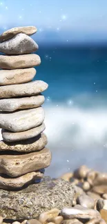 Stack of stones on a beach with ocean in the background.