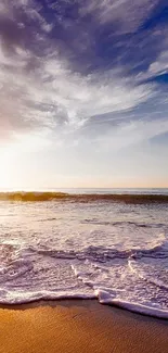 Tranquil beach sunrise with waves and a colorful sky, perfect phone wallpaper.