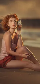 A serene beach scene with a warm sunset glow and a woman sitting peacefully on the sand.