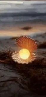 A glowing pearl inside a seashell on the beach at sunset.