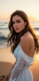 Woman in white dress at sunset beach with ocean waves.