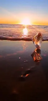 Orange sunset over beach with crystal reflection.