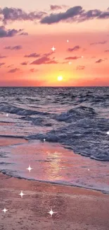 A calming beach sunset with pink and orange hues over the ocean.