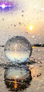 Crystal sphere reflecting sunset at serene beach.